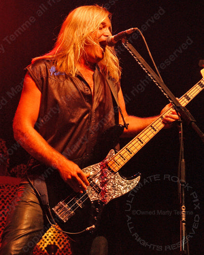 Photo of bass player Barry Sparks of Ted Nugent and Dokken in concert by Marty Temme