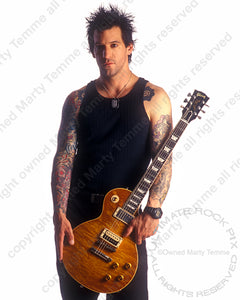 Photo of guitarist Keith Nelson of Buckcherry with his Gibson Les Paul during a photo shoot in 2001 by Marty Temme