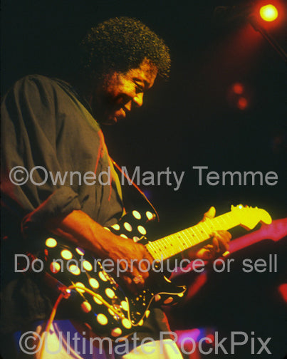 Photo of Buddy Guy playing a polkadot Stratocaster in concert