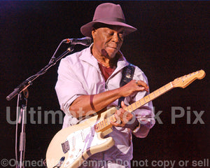 Photo of guitar player Buddy Guy playing a Stratocaster in concert by Marty Temme