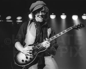 Photo of musician Bob Welch of Fleetwood Mac playing a Gibson Les Paul in concert in 1978 by Marty Temme