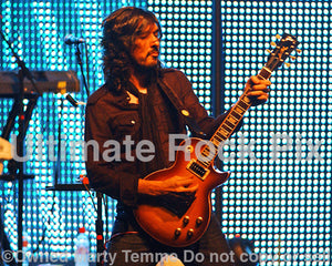 Photo of guitarist Yogi Lonich performing with Chris Cornell in 2008 by Marty Temme