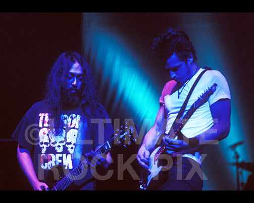 Photo of Chris Cornell and Kim Thayil of Soundgarden playing guitar together in concert by Marty Temme
