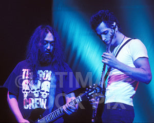 Photo of Chris Cornell and Kim Thayil of Soundgarden playing guitar together onstage in 1996 by Marty Temme