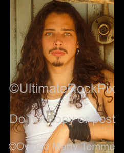 Photo of Chris Cornell looking into the camera during a photo shoot in 1991 by Marty Temme