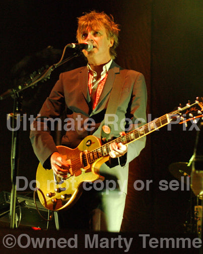 Photo of Neil Finn of Crowded House playing a Gibson Goldtop in concert by Marty Temme