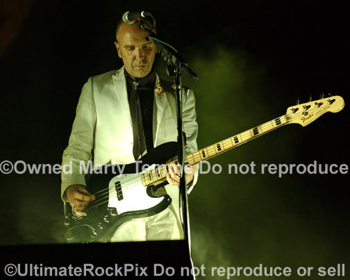 Photo of Nick Seymour of Crowded House playing a Fender Jazz Bass in concert in 2007 by Marty Temme
