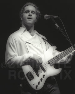 Photo of Jason Scheff of Chicago in concert in 1990 by Marty Temme