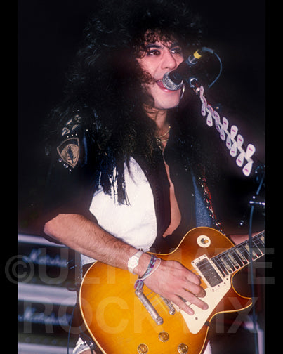 Photo of Jeff LaBar of Cinderella playing a Les Paul in concert in 1989 by Marty Temme