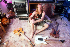 Photo of Phil Collen of Def Leppard with his guitars in 1994 by Marty Temme