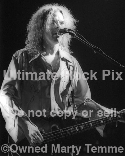 Photo of bass player Robert Kearns of Cry of Love in concert in 1997 by Marty Temme