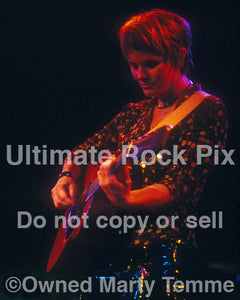Photo of Shawn Colvin playing acoustic guitar in concert by Marty Temme