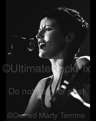 Black and white photo of singer Dolores O'Riordan of The Cranberries in concert by Marty Temme