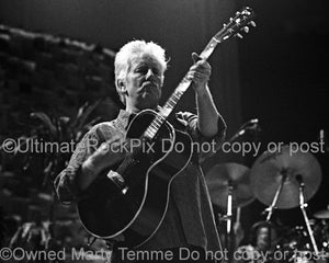 Photo of Graham Nash of Crosby, Stills, Nash and Young in concert by Marty Temme