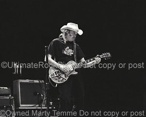 Black and White Photos of Neil Young of CSNY Performing in Concert by Marty Temme