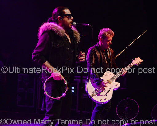 Photo of Ian Astbury and Billy Duffy of The Cult in concert in 2012 by Marty Temme