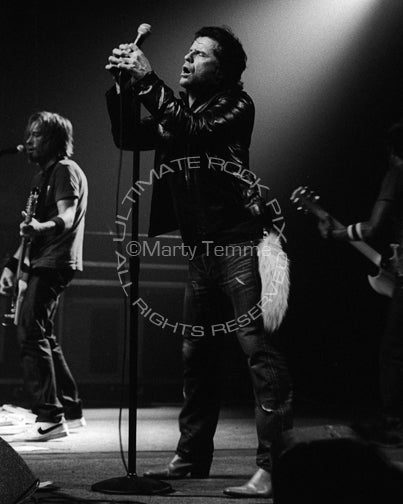 Black and white photo of Ian Astbury of The Cult performing in concert by Marty Temme