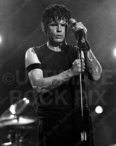Black and white photo of vocalist Ian Astbury of The Cult performing onstage by Marty Temme