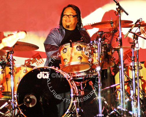 Photo of drummer Curt Bisquera in concert by Marty Temme