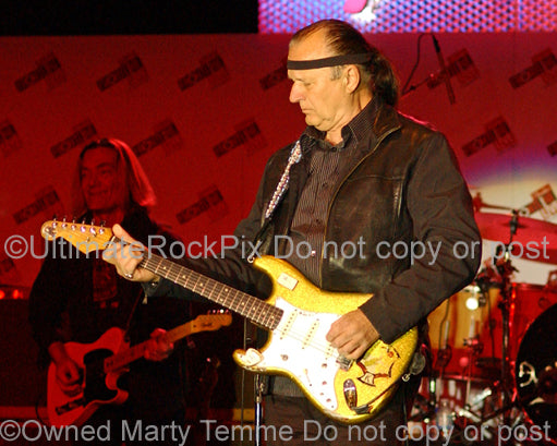 Photo of Dick Dale playing a Stratocaster in concert by Marty Temme