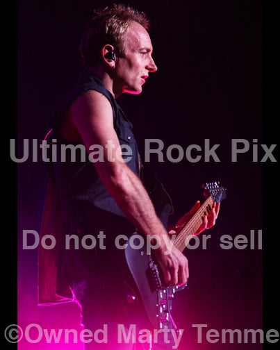 Photo of Phil Collen of Def Leppard in concert in 2006 by Marty Temme