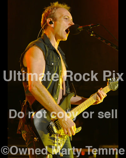 Photo of Phil Collen of Def Leppard in concert in 2006 by Marty Temme