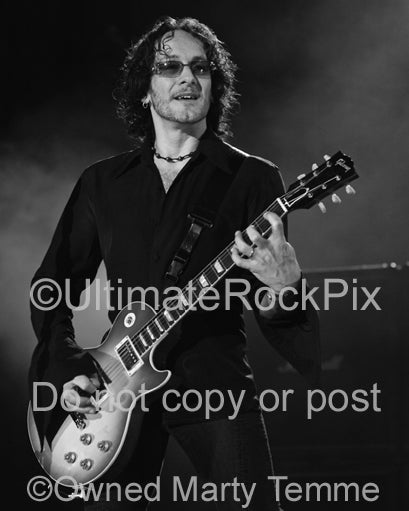 Black and white photo of Vivian Campbell of Def Leppard in concert by Marty Temme
