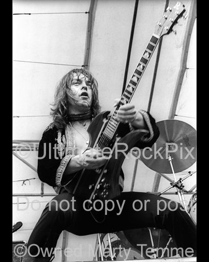 Photo of Rick Derringer of Derringer in concert in 1977 by Marty Temme