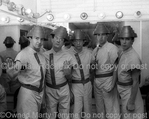 Black and white photo of the band Devo backstage in 1980 by Marty Temme