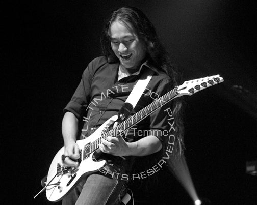 Black and white photo of Herman Li of DragonForce in concert by Marty Temme