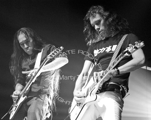 Black and white photo of Herman Li and Sam Totman of DragonForce in concert by Marty Temme