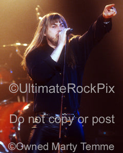 Photo of Don Dokken singing in concert in 1995 by Marty Temme