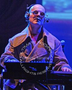 Photo of musician Thomas Dolby playing keyboards in concert