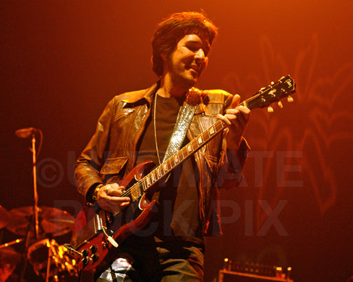 Photo of guitarist Yogi Lonich in concert in 2009 by Marty Temme