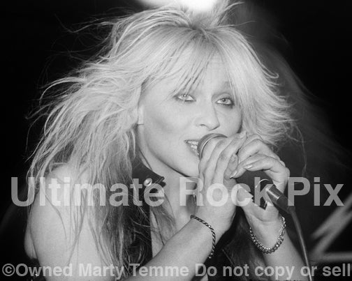 Black and white photo of Doro Pesch in concert in 1990 by Marty Temme