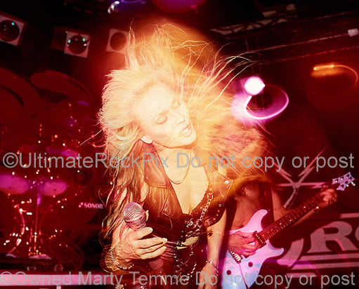 Photo of Doro Pesch in concert in 1990 by Marty Temme