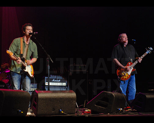 Photo of guitar players Doyle Bramhall II and David Hidalgo in concert by Marty Temme
