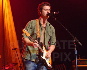 Photo of Doyle Bramhall II playing a Stratocaster in 2010 by Marty Temme
