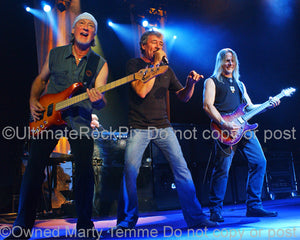 Photo of Roger Glover, Ian Gillan and Steve Morse of Deep Purple in concert in 2007 by Marty Temme
