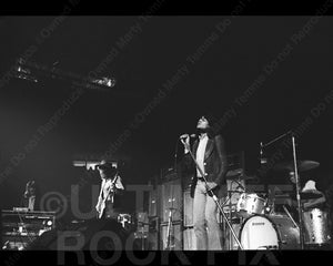 Photo of Jon Lord, Roger Glover, Ian Gillan and Ian Paice of Deep Purple in concert in 1972 by Marty Temme