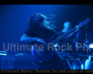 Photo of bassist John Myung of Dream Theater in concert in 2011 by Marty Temme