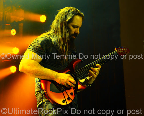 Photo of guitarist John Petrucci of Dream Theater in concert in 2014 by Marty Temme
