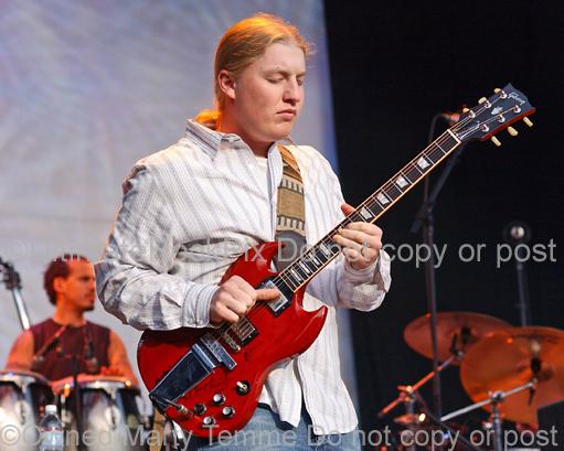 Photos of Derek Trucks of The Allman Brothers Playing Slide Guitar in Concert in 2006 by Marty Temme