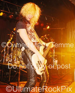 Photos of Bass Player Duff McKagan of Guns N' Roses Performing Onstage in 1990 by Marty Temme