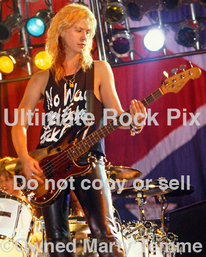 Photo of bass player Duff McKagan of Guns N' Roses performing onstage in 1989 by Marty Temme