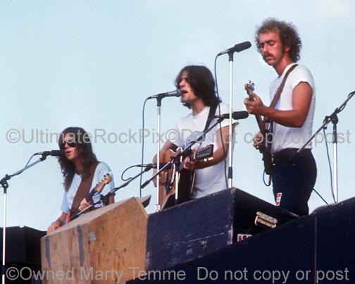 Photos of Randy Meisner, Glenn Frey and Bernie Leadon of The Eagles in Concert in 1974 by Marty Temme