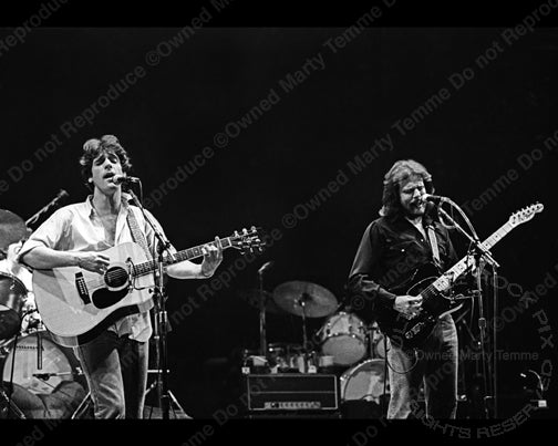 Photo of Glenn Frey and Don Felder of The Eagles in concert in 1980 by Marty Temme