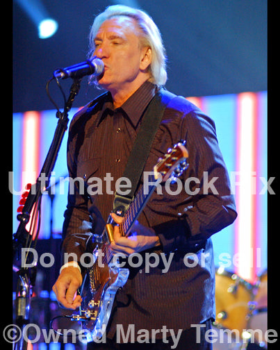 Photo of Joe Walsh of The Eagles playing a Dan Armstrong guitar in 2008 by Marty Temme