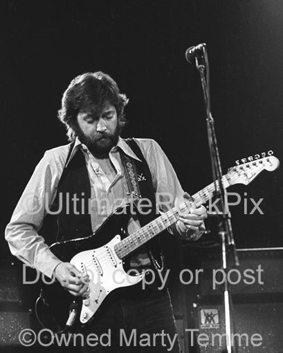 Photo of Eric Clapton playing his Stratocaster in concert in 1979 by Marty Temme