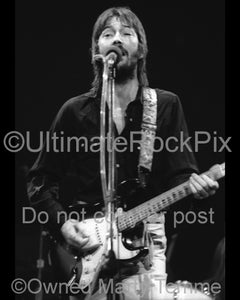 Black and white photo of Eric Clapton playing his Stratocaster in 1974 by Marty Temme